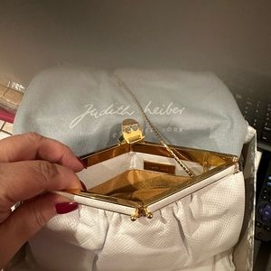 Selling a white exotic leather clutch purse.